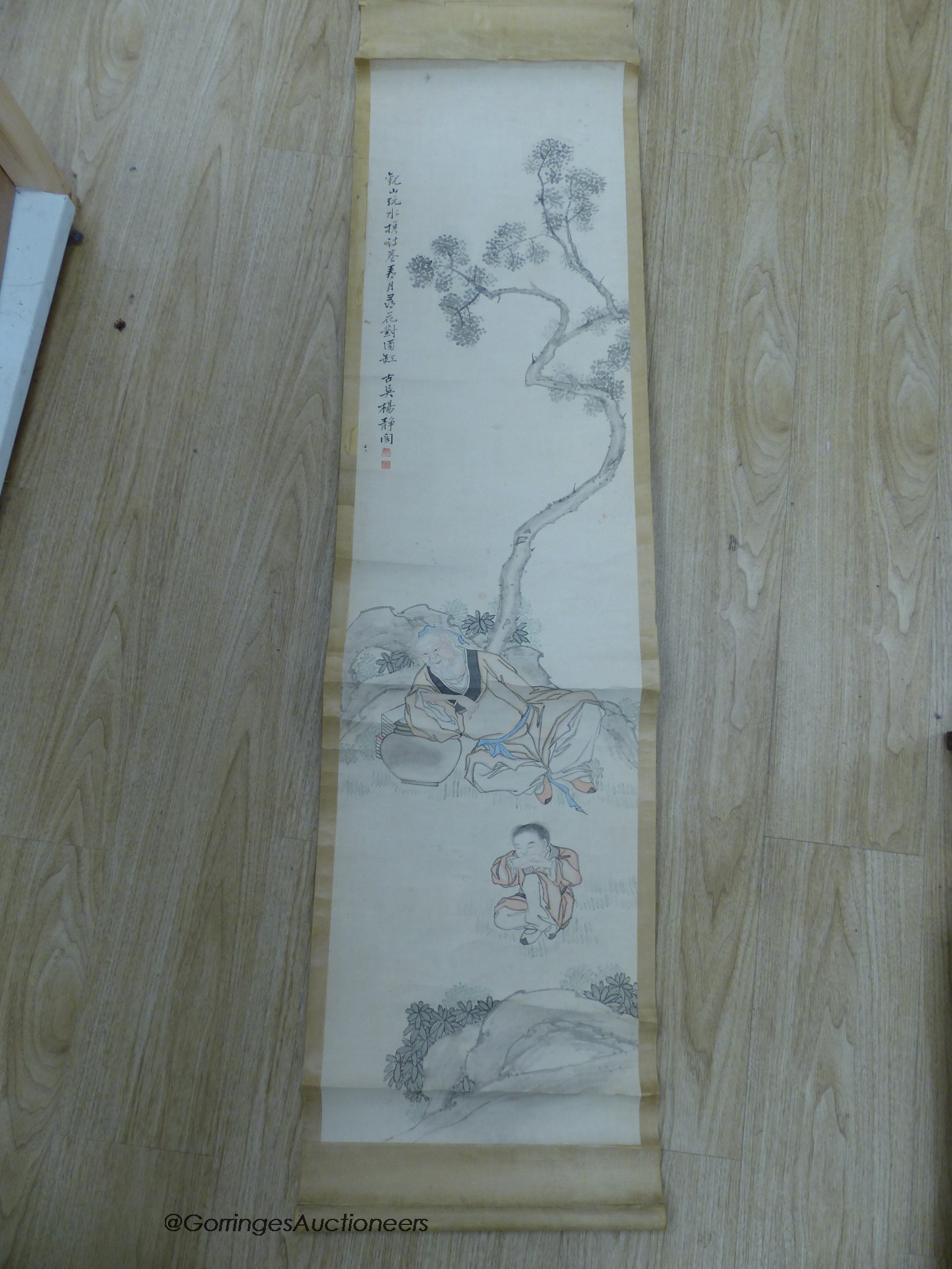 An early 20th century Chinese scroll painting on paper and scholar and boy